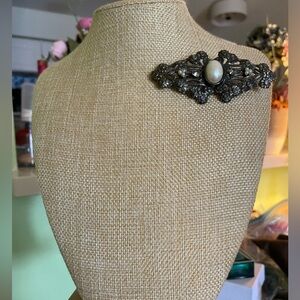 Ornate gunmetal and pearl brooch